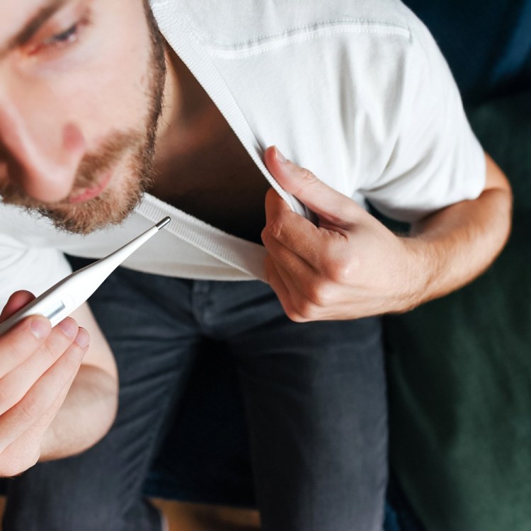 Man taking temperature