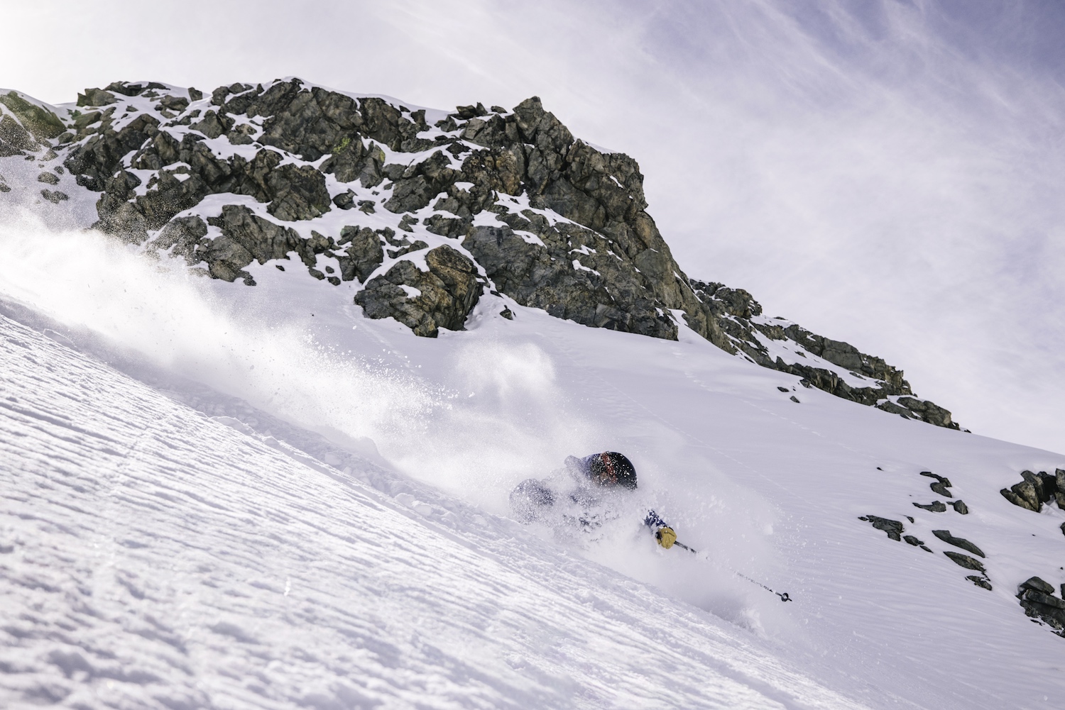 A spray of snow around a skier in action.