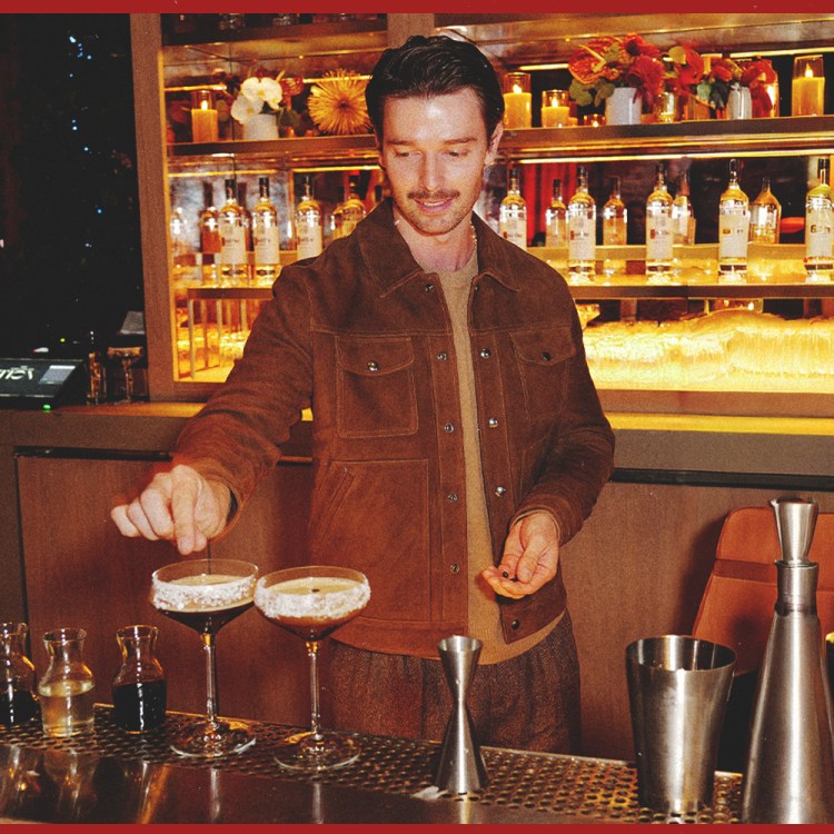 Patrick Schwarzenegger garnishing a ketel one espresso martini behind the bar