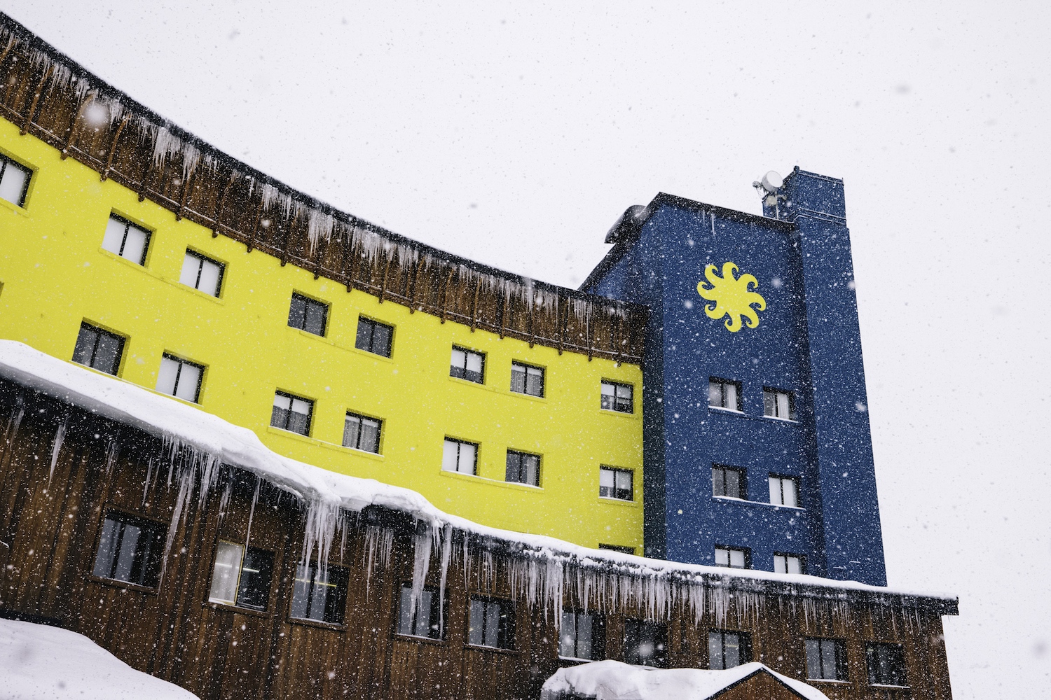 A view of the yellow hotel.