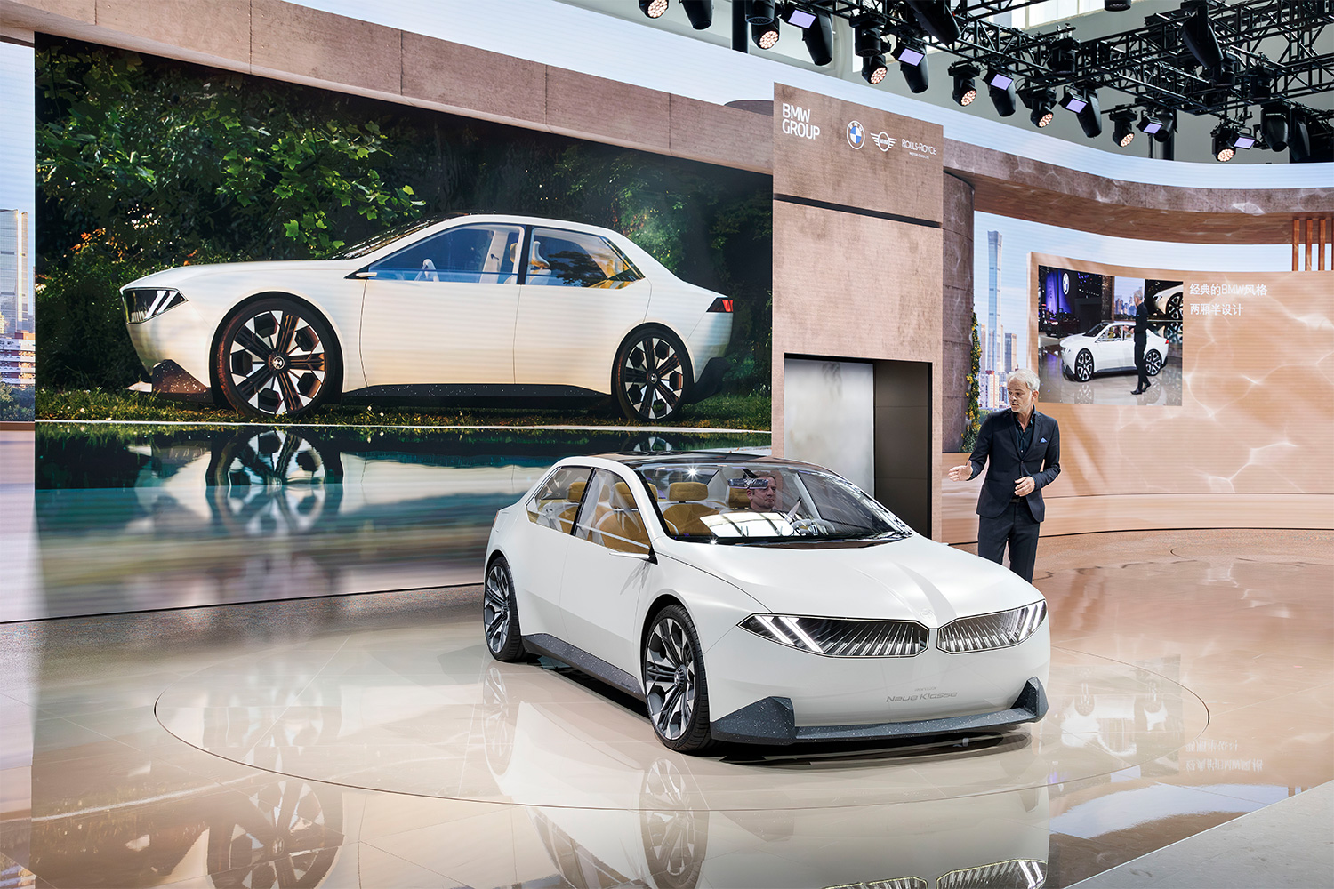 BMW Design Director Adrian van Hooydonk shows off the Vision Neue Klasse concept at Auto China 2024.