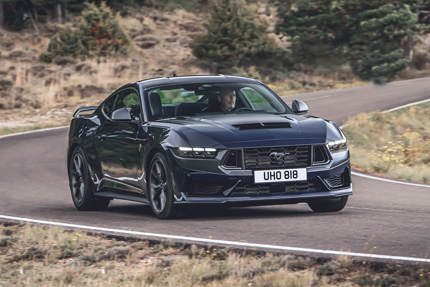 The Ford Mustang Dark Horse rounding a corner