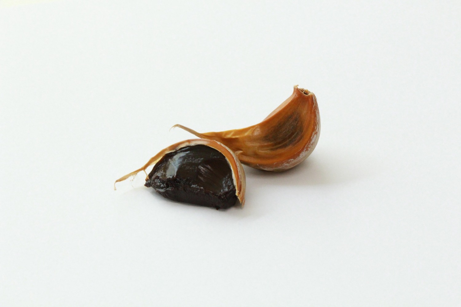 black garlic on a white background