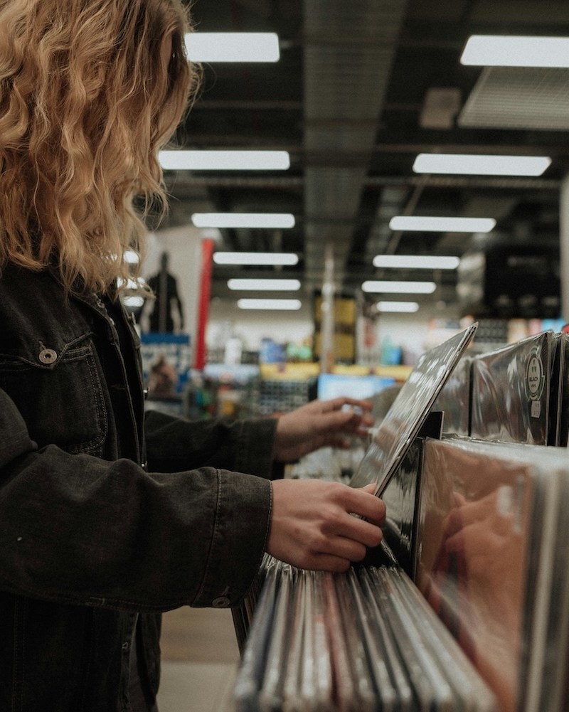 A woman looking through records
