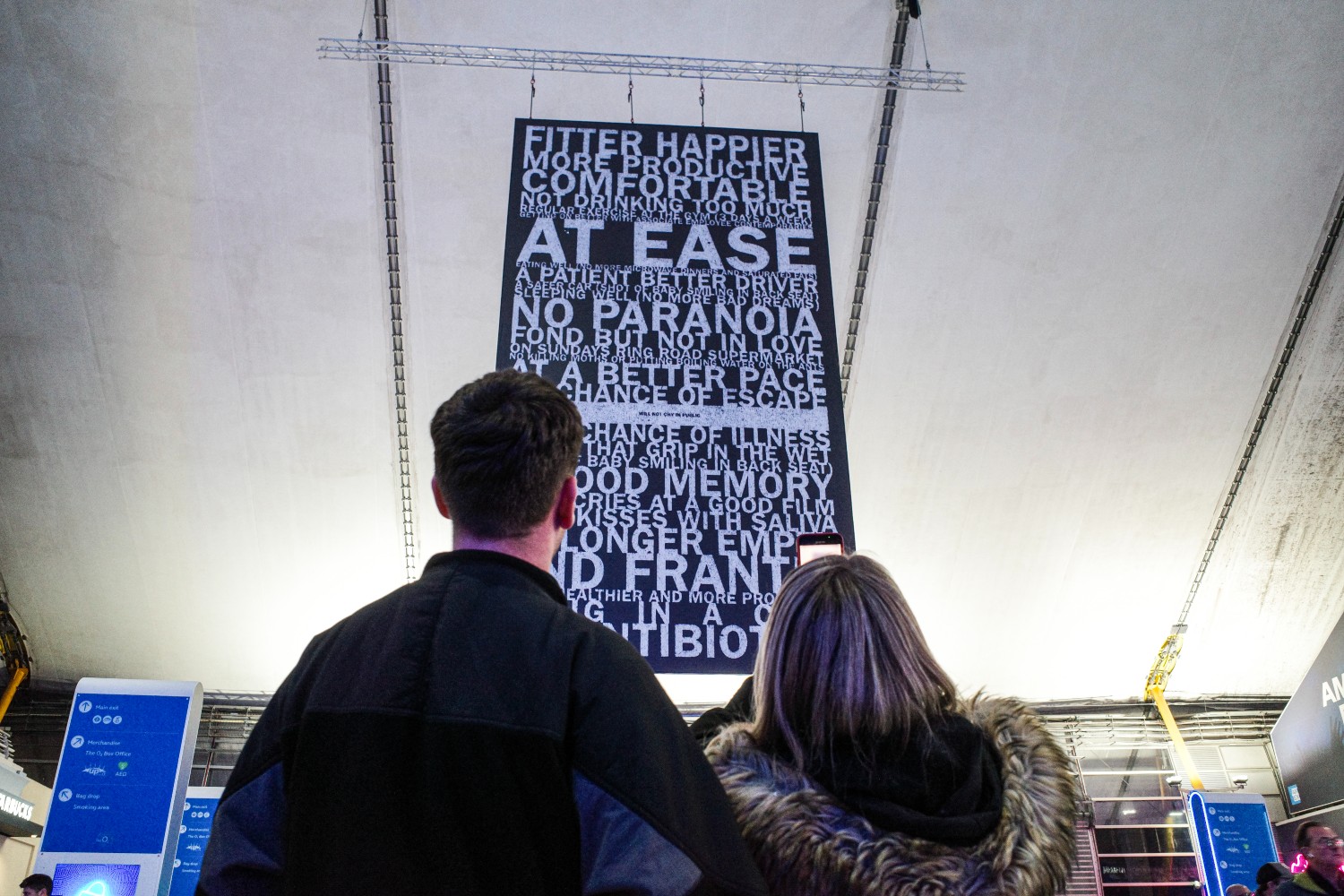 Radiohead fans looking up at a banner