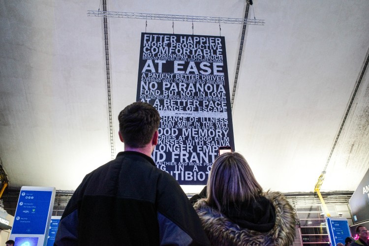 Radiohead fans looking up at a banner