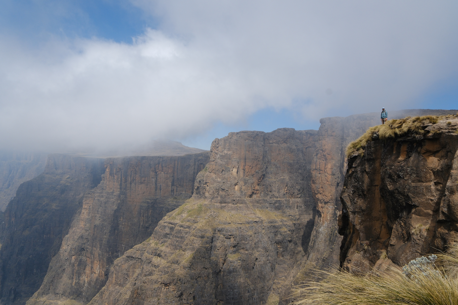 A man standing atop South Africa's Tugela Falls.