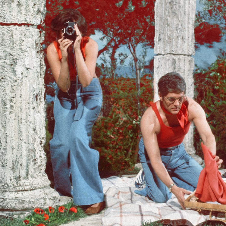 A man and woman taking photos together