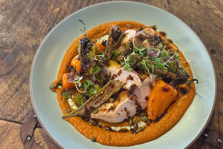 An airline chicken breast with romesco sauce and mini bell peppers, from The Ranch at Rock Creek. I got the recipe.