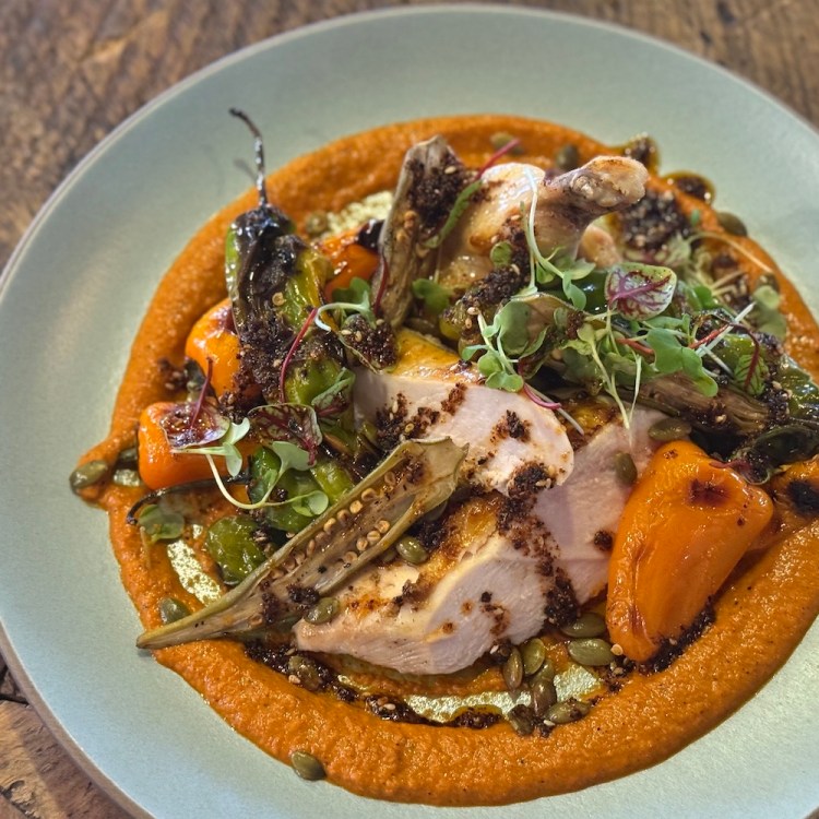 An airline chicken breast with romesco sauce and mini bell peppers, from The Ranch at Rock Creek. I got the recipe.