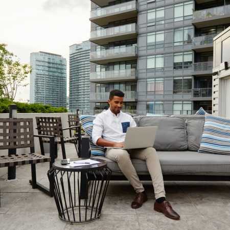 Man in Airbnb on laptop