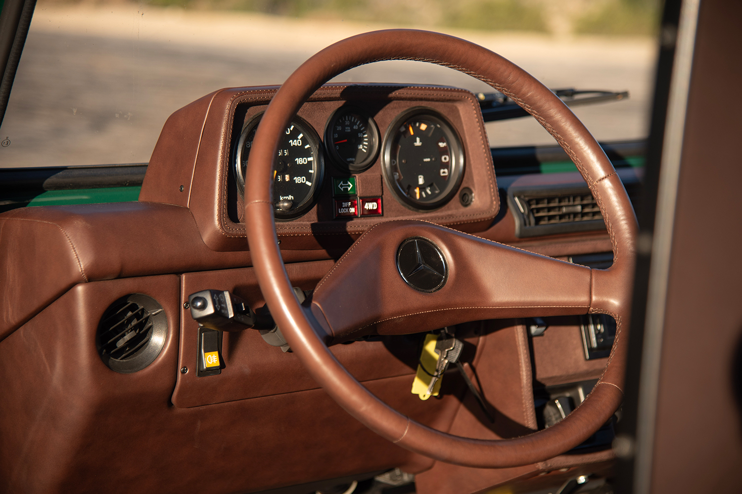 Inside the driver's side of a Mercedes-Benz G-Class SUV restomod from Arcade Cars