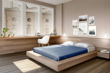 Bed near large windows