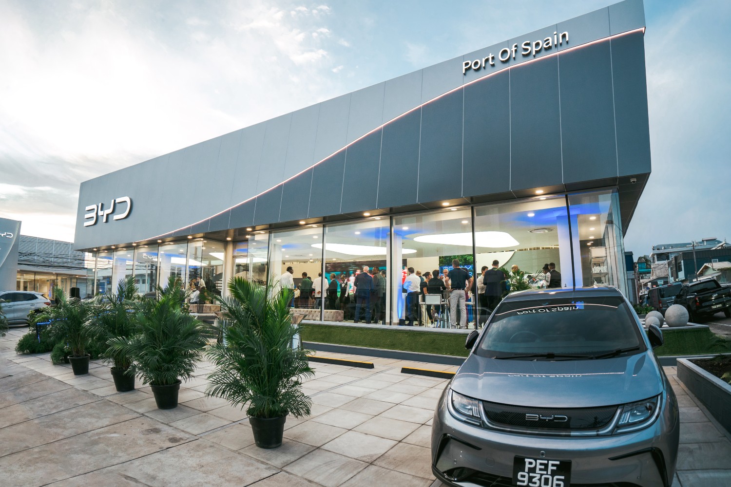 A BYD dealership with a car out front