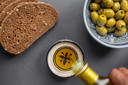 Bread, olive oil and olives on a table
