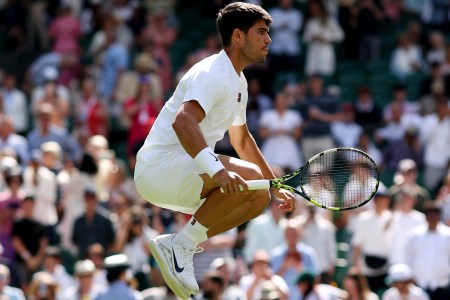 A photo of Carlos Alcaraz jumping up and down at Wimbledon.