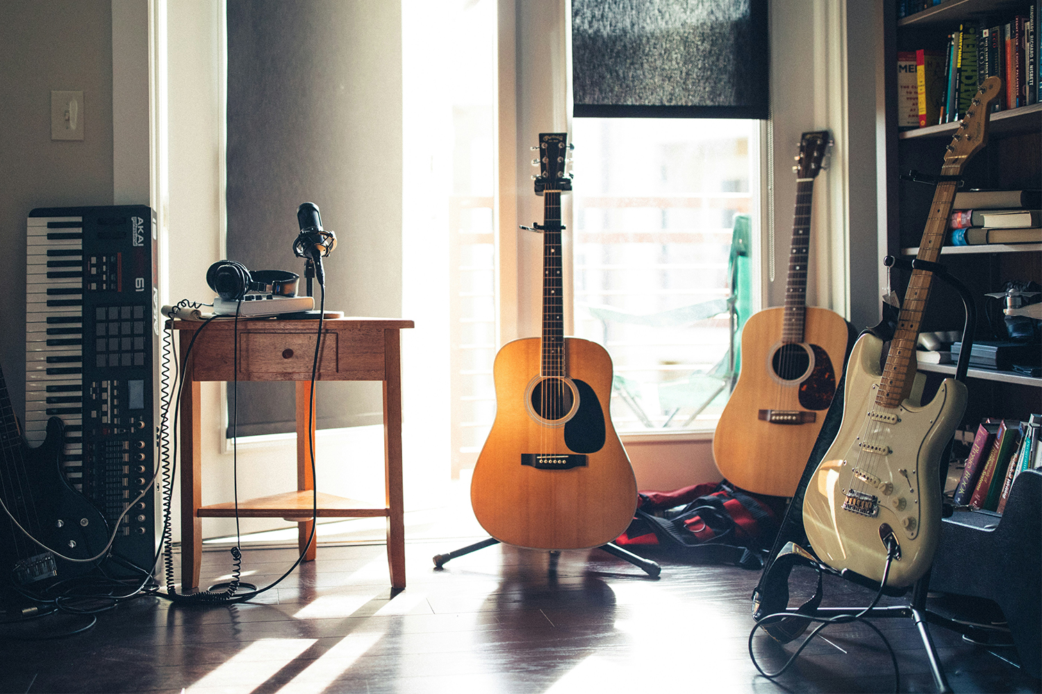 Guitars, a microphone and a keyboard in a studio