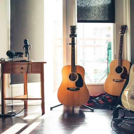 Guitars, a microphone and a keyboard in a studio