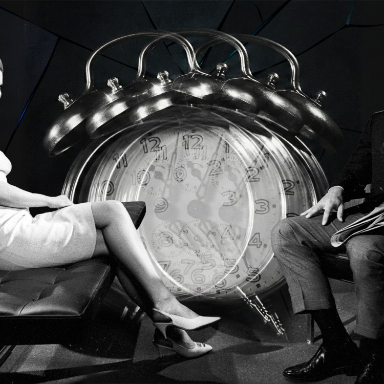 A couple with an alarm clock in the middle