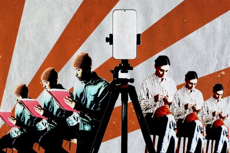 Person sitting reading a book and a person crocheting with a phone on a tripod in the midda