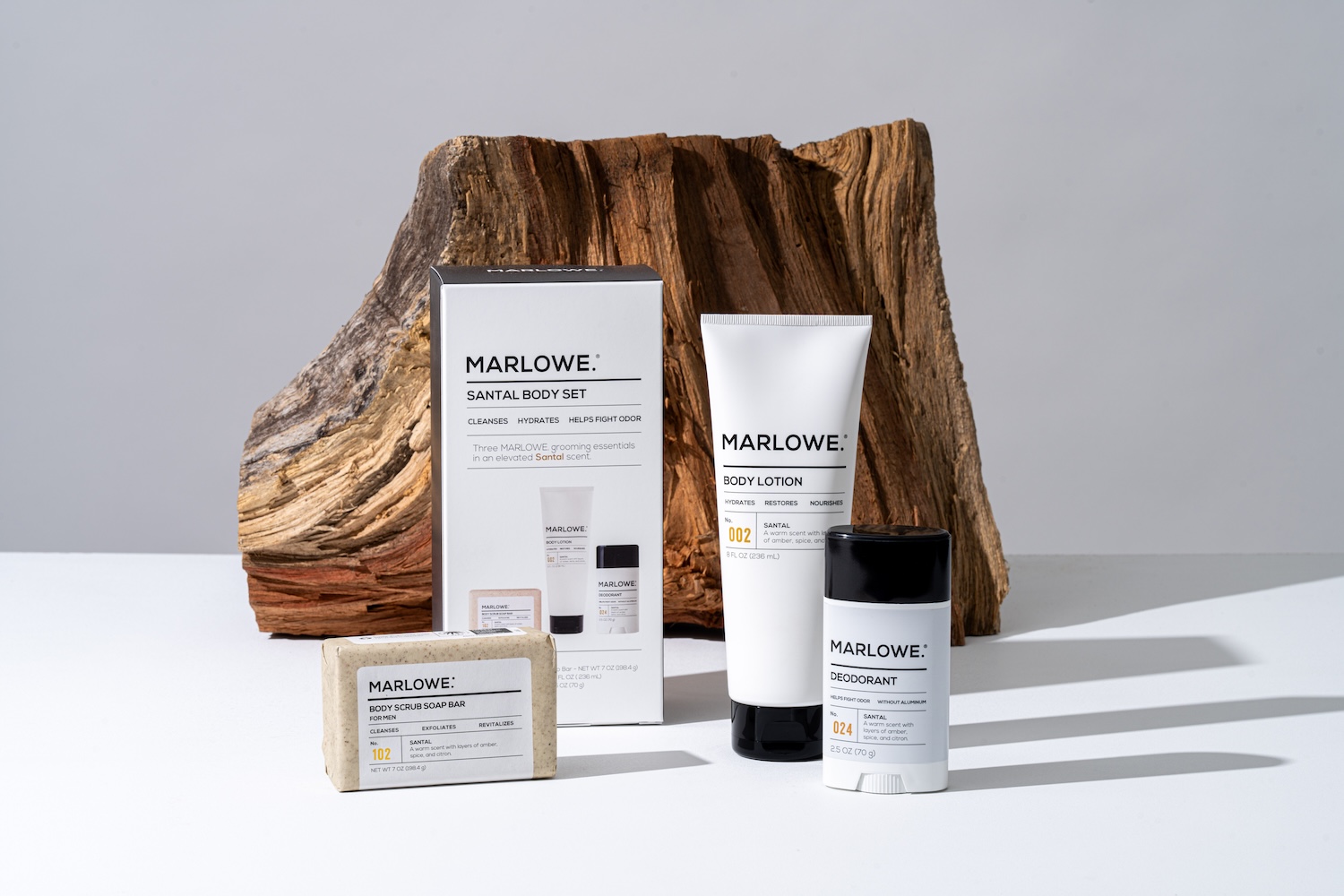 The Marlowe Santal Body Set on display, including a body lotion, deodorant and bar soap 