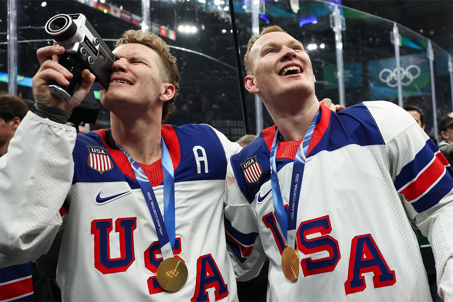 Gold medalist Matthew Tkachuk #19 and Brady Tkachuk #7 of Team United States celebrate after the medal ceremony for Men's Ice Hockey following the Men's Gold Medal match between Canada and the United States on day 16 of the Milano Cortina 2026 Winter Olympic games at Milano Santagiulia Ice Hockey Arena on February 22, 2026 in Milan, Italy.