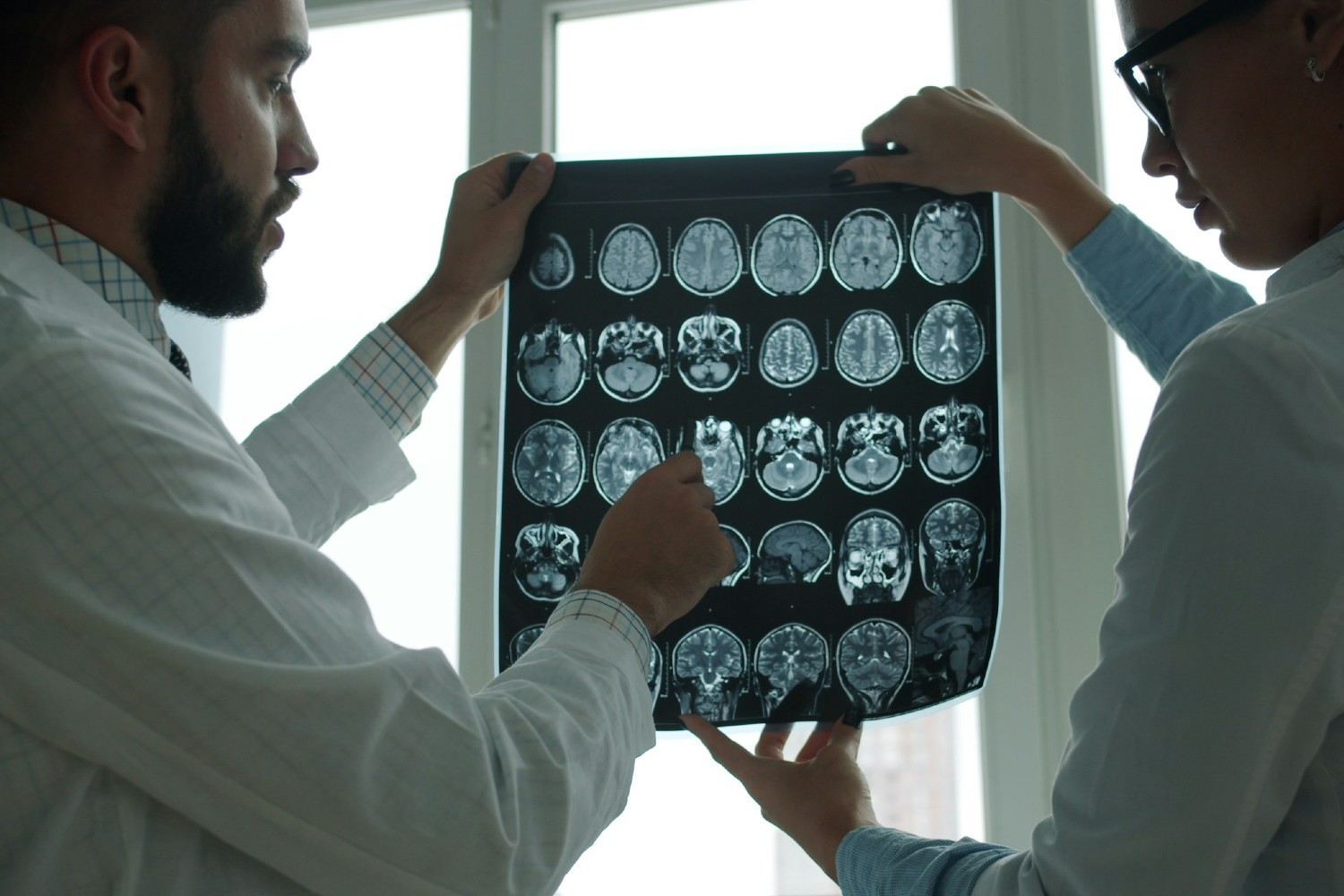 Doctors looking at brain scans