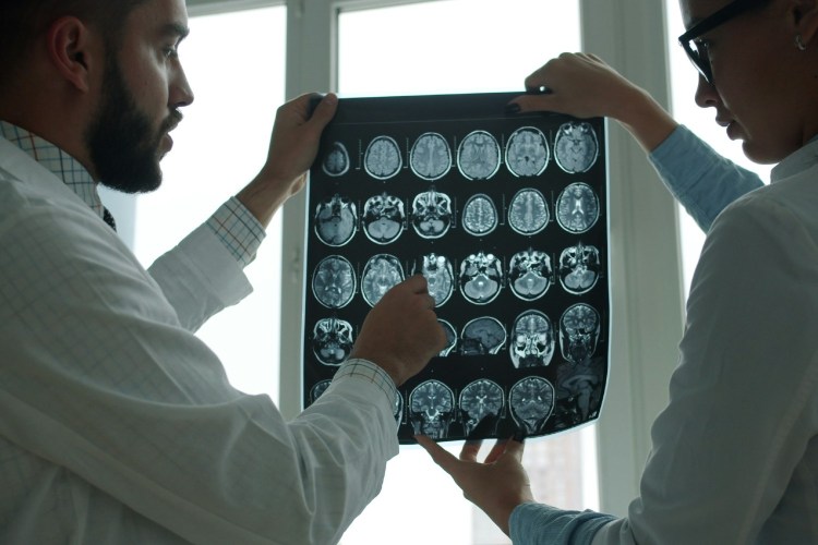 Doctors looking at brain scans
