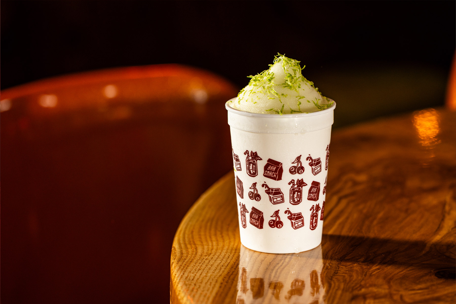 Mama Tried cocktail on bar top in white plastic cup