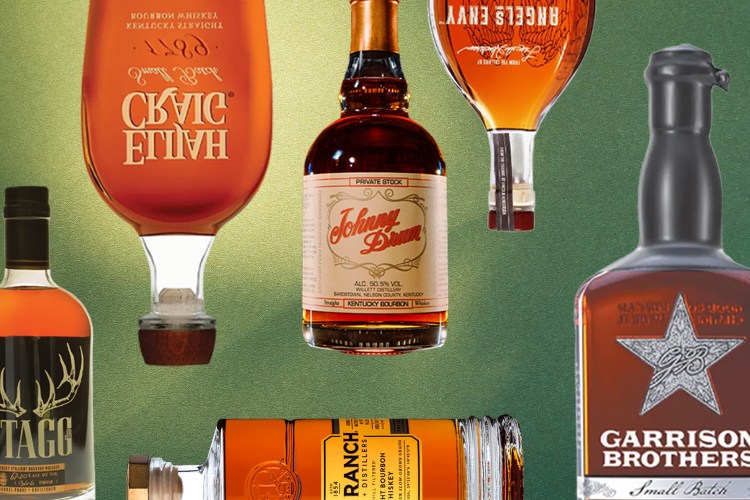 bourbon bottles arranged on a green ombre background