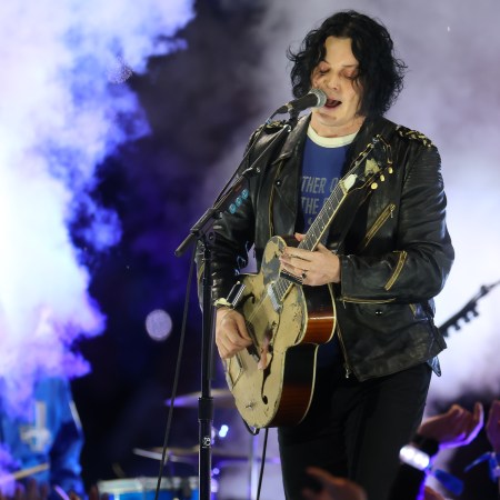 Jack White playing guitar at a concert. He recently said in an interview that he finds autobiographical songwriting "boring."