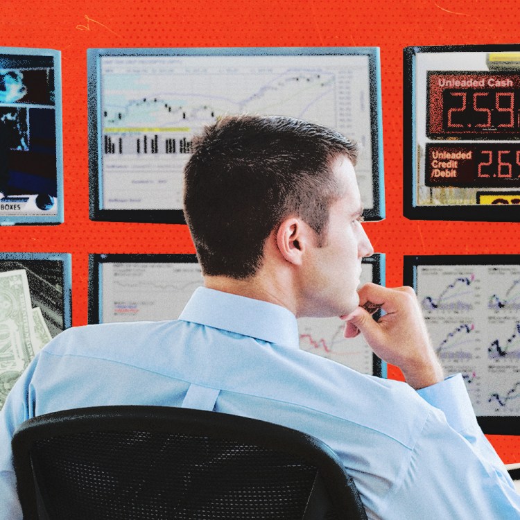 A man analyzing multiple screens with news and charts