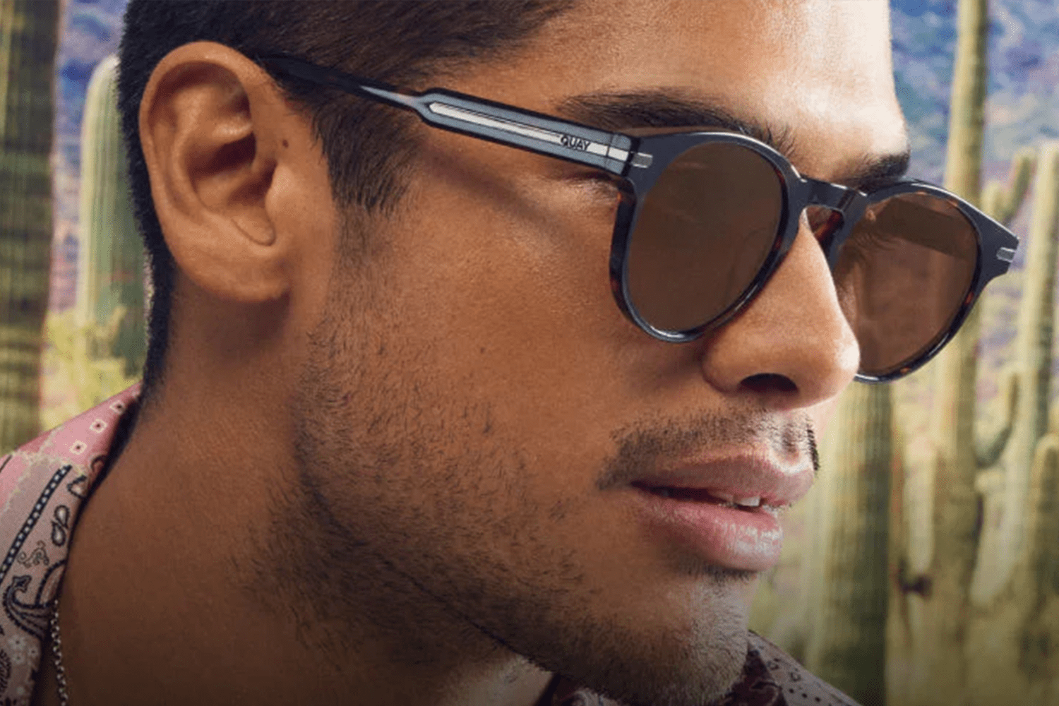 lifestyle image from Quay of man wearing sunglasses