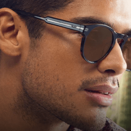 lifestyle image from Quay of man wearing sunglasses
