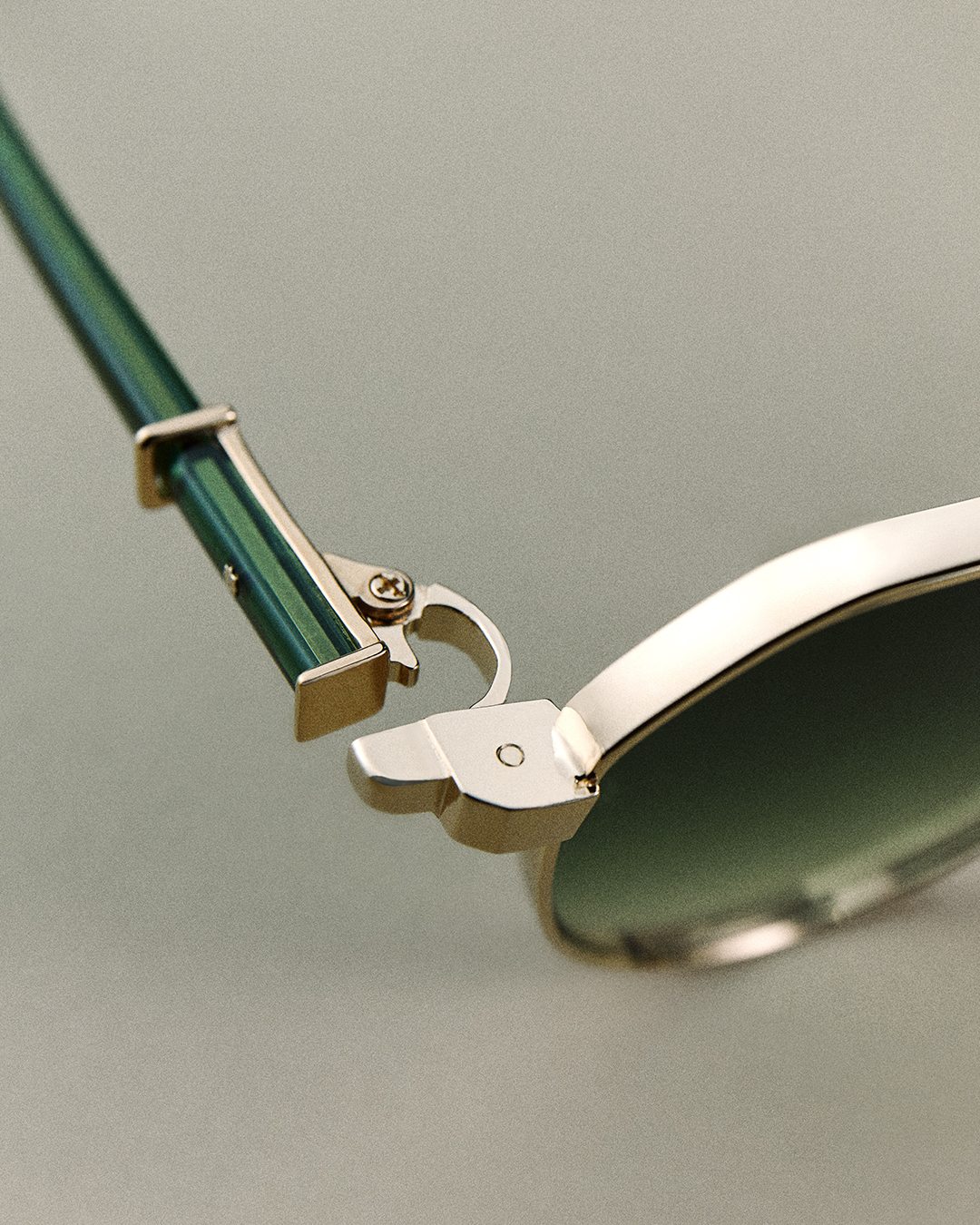 A close-up on the hinge on a pair of Robert Marc glasses