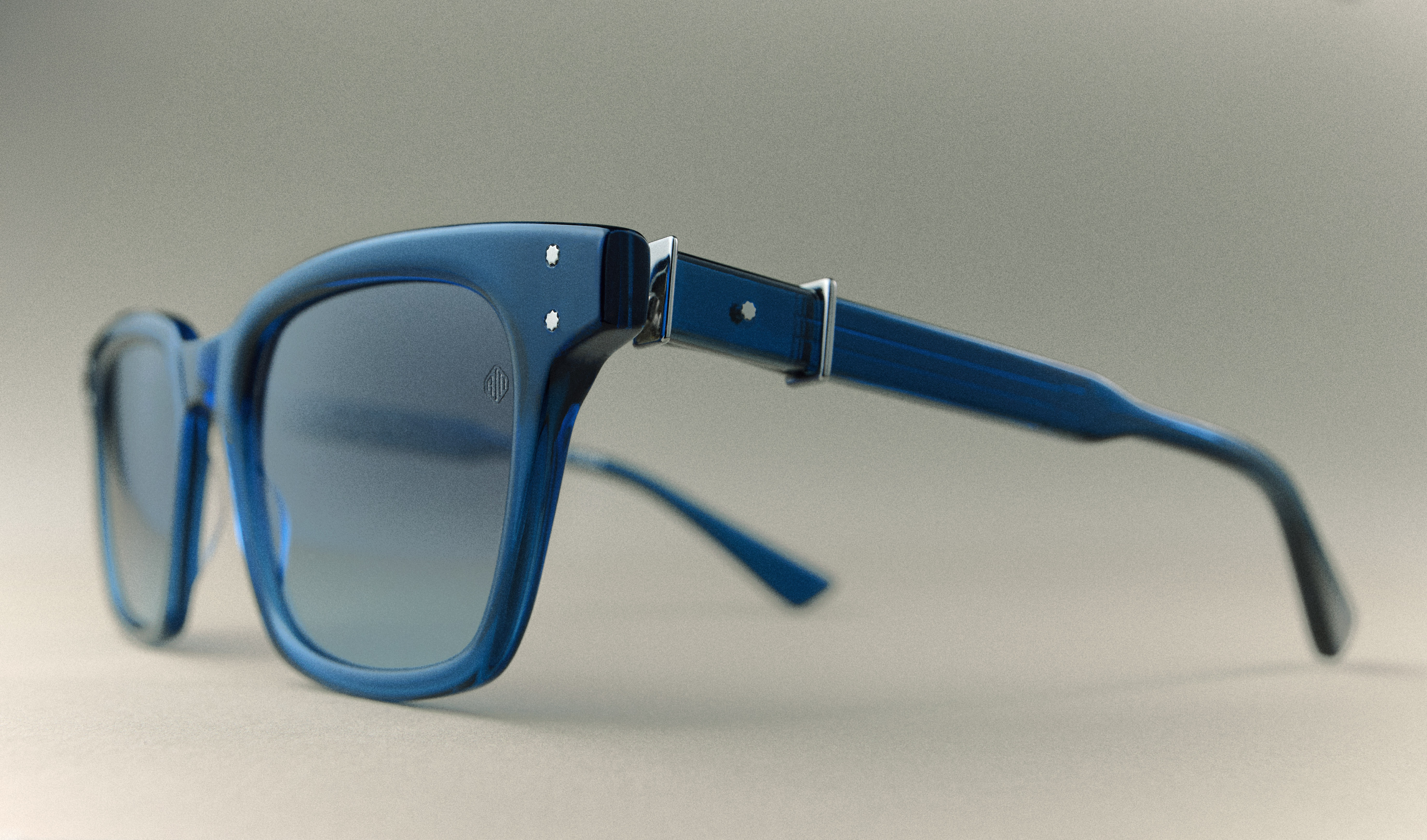 A pair of Robert Marc glasses with blue frames