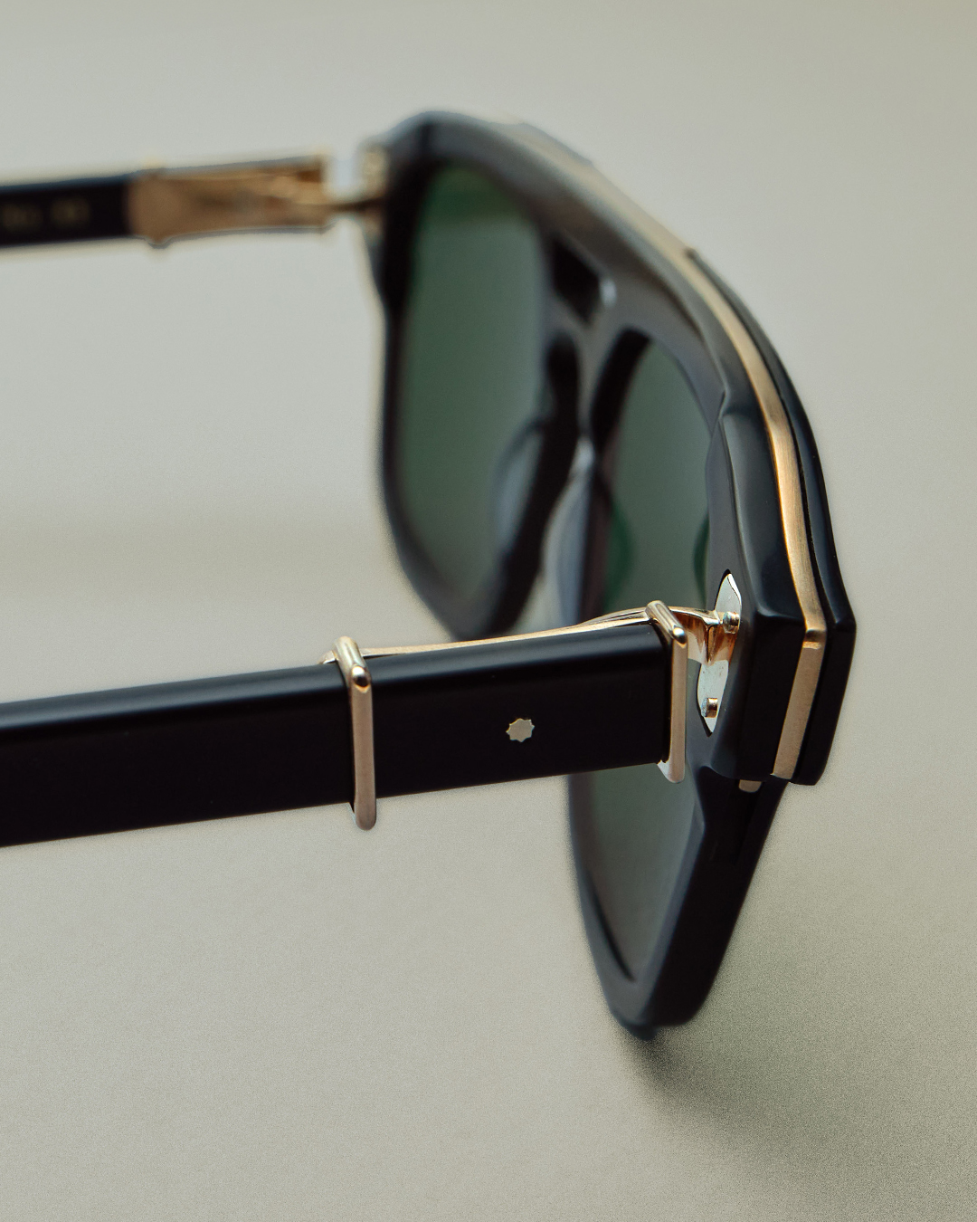 A close-up of the hinge on a pair of Robert Marc frames