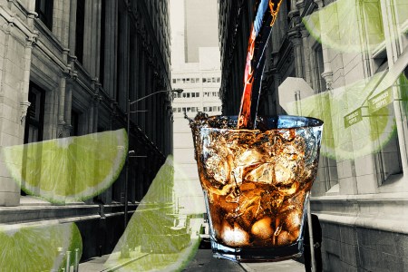 A rum and coke, limes and a city skyline