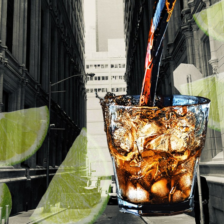 A rum and coke, limes and a city skyline