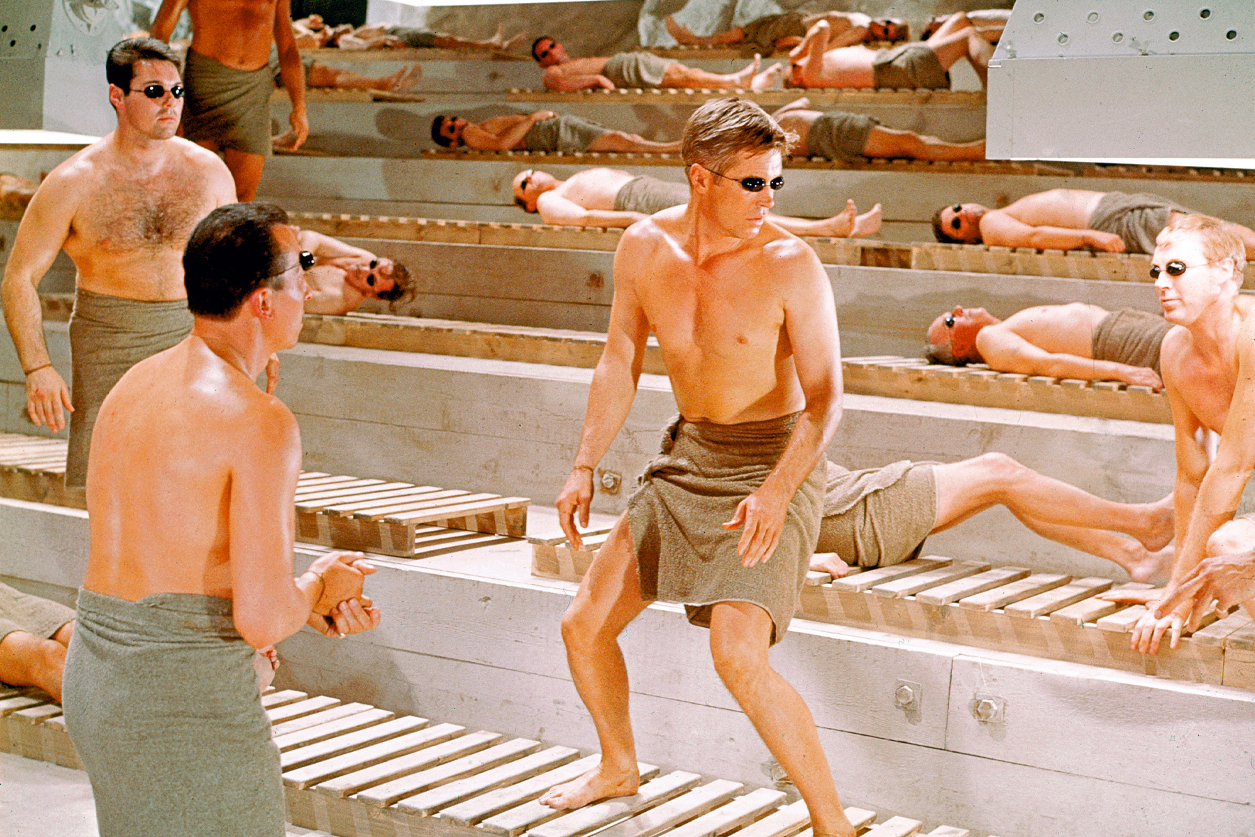 A bunch of men in a sauna at a bachelor party weekend