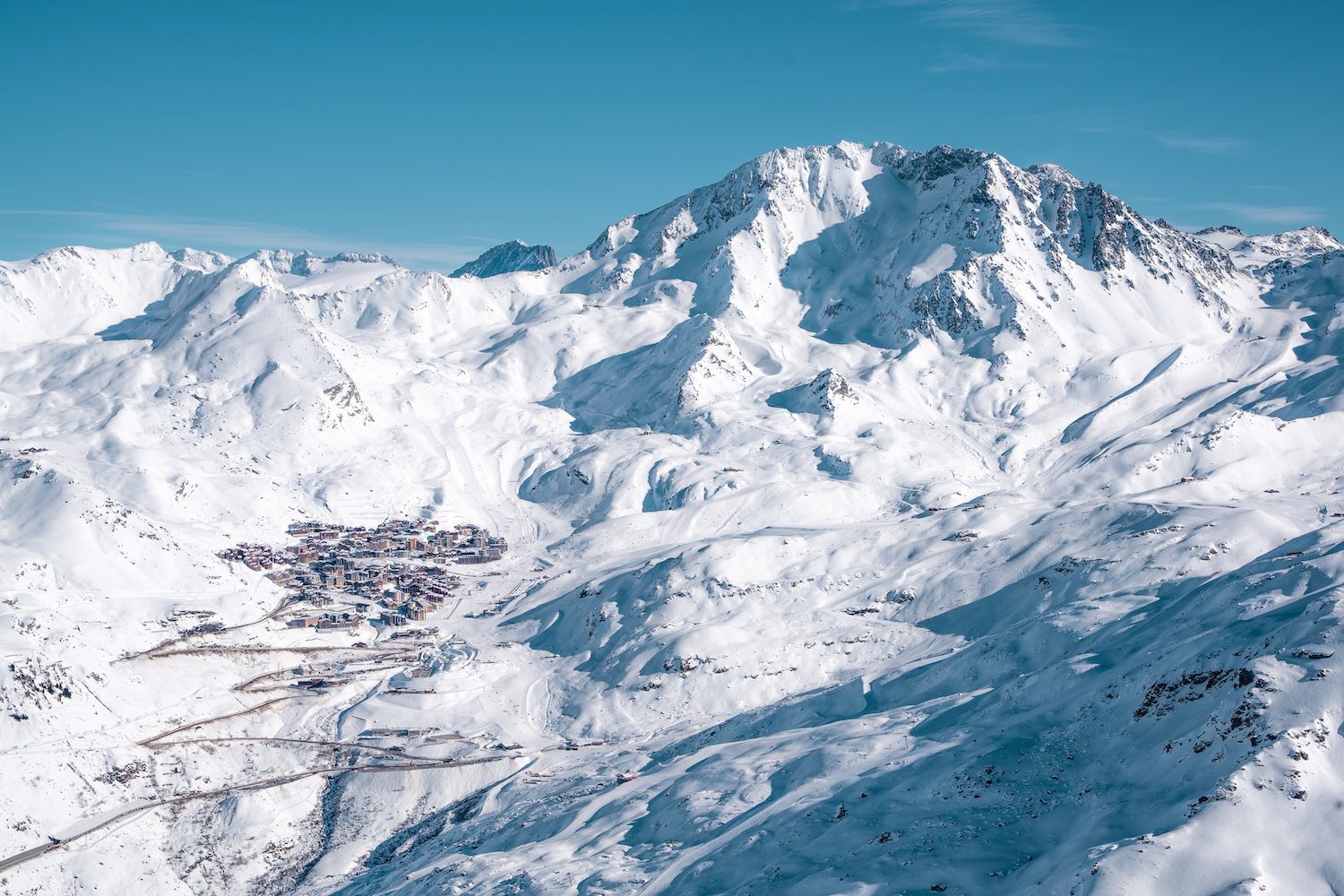 A dramatic alpine view of a ski village in The Three Valleys.