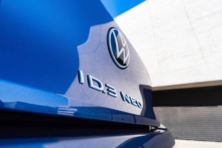 Back of a blue Volkswagen with "ID.3 NEO" on it`