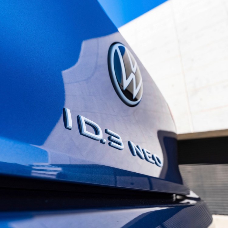 Back of a blue Volkswagen with "ID.3 NEO" on it`