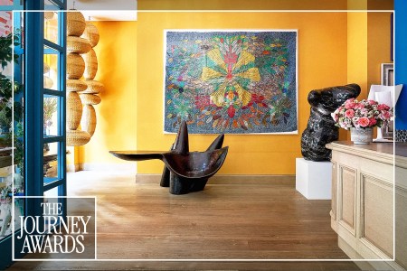A communal interior space at a Firmdale hotel in New York City, showcasing curated, vibrant art and design details.