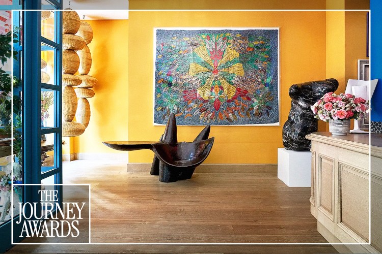 A communal interior space at a Firmdale hotel in New York City, showcasing curated, vibrant art and design details.