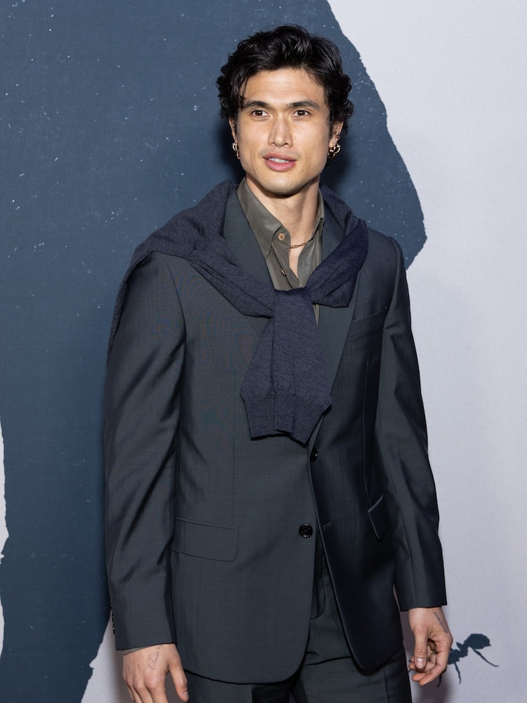 A man with black hair and a navy suit