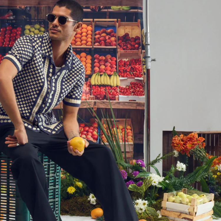 quay lifestyle image of man wearing sunglasses surrounded by flowers