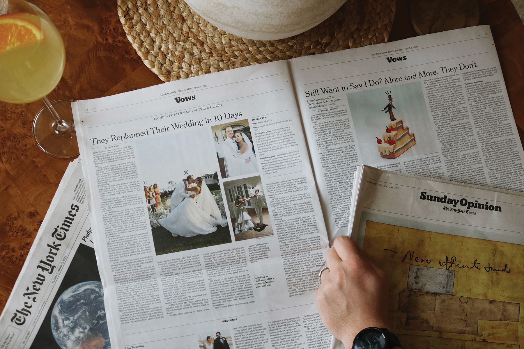 A person flipping through the Vows section of "The New York Times" that features wedding announcements
