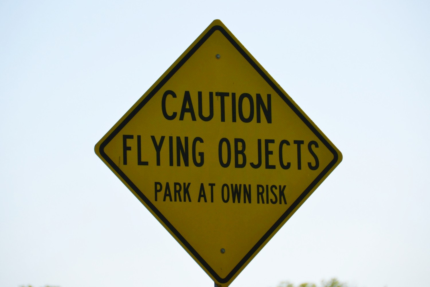 "Caution Flying Objects" sign