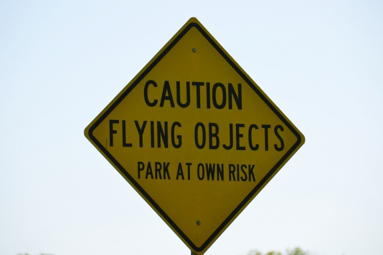 "Caution Flying Objects" sign